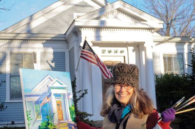 Family Masterpiece 
With the help of unseasonably warm weather, Visual Artist Jill Hoy paints a Mattapoisett Village home. The artwork was commissioned by two children for their parents as a surprise 30th anniversary gift. Photo by Felix Perez. January 26, 2012 edition
