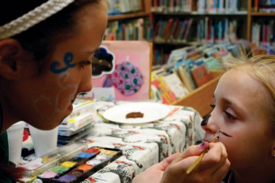 Summer Reading Program
Catherine Wheeler (left) paints Grace McCarthy's face like a cat during the party at Plumb Library, which celebrated the success of its summer reading program, which saw a doubling in the number of participants and hours read.  Photo by Eric Tripoli.
