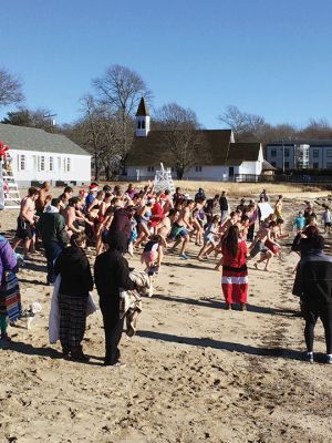 15th annual Christmas Day Swim
With light breezes and near freezing temperatures, Christmas Day 2016 found a hail and hearty group diving into Mattapoisett Harbor from town beach to benefit Helping Hands and Hooves. The 15th annual Christmas Day Swim took place at 11:00 am with many participants saying it was a family tradition they cherish. One hundred percent of the proceeds benefit the nonprofit organization that provides therapeutic horseback riding lessons to adults and children with disabilities. Photos by Marilou Newell
