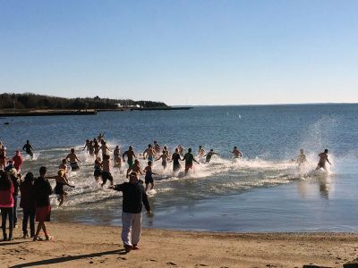 15th annual Christmas Day Swim
With light breezes and near freezing temperatures, Christmas Day 2016 found a hail and hearty group diving into Mattapoisett Harbor from town beach to benefit Helping Hands and Hooves. The 15th annual Christmas Day Swim took place at 11:00 am with many participants saying it was a family tradition they cherish. One hundred percent of the proceeds benefit the nonprofit organization that provides therapeutic horseback riding lessons to adults and children with disabilities. Photos by Marilou Newell
