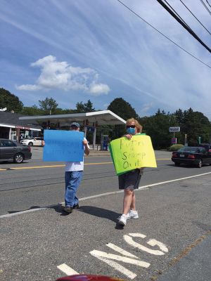 Save the Post Office
Members of the Mattapoisett Democratic committee were expressing their opinions at the corners of Route 6 and North Street on Saturday August 22nd. Photo by Marilou Newell
