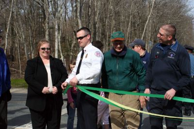 Rail Trail
Bill Straus, State Representative, Steve Kelleher, Chairman of Mattapoisett Rail Trail, and Jordan Collyer, Vice-Chairman of the Mattapoisett Board of Selectman (left to right) cut the ribbon to open the Inauguration of the Mattapoisett Rail Trails Old Colony Mile. Photo by Sarah K. Taylor. 
