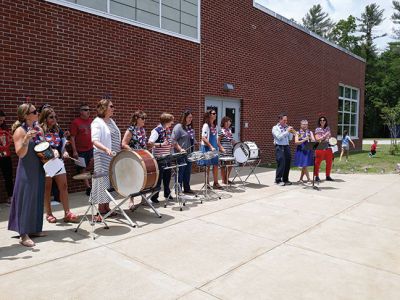 Rochester Memorial School 
As the school doors opened at Rochester Memorial School on the afternoon of Friday, June 14, teachers and administration carried on the tradition of playing instruments as a final farewell to the students as the school buses circled the parking lot, honking, as students laughed, waved, and cheered. Photos by Michelle Lynds

