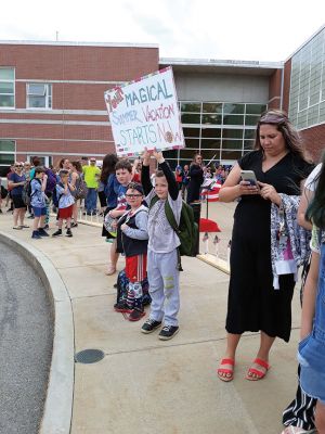 Rochester Memorial School 
As the school doors opened at Rochester Memorial School on the afternoon of Friday, June 14, teachers and administration carried on the tradition of playing instruments as a final farewell to the students as the school buses circled the parking lot, honking, as students laughed, waved, and cheered. Photos by Michelle Lynds
