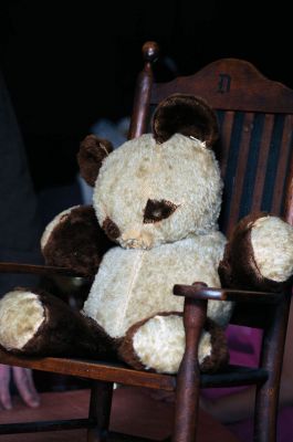 Antiques in Rochester
A teddy bear won at a carnival by Nancy Boutin's father for her mother in the early 1940's was appraised by Frank McNamee for $50 to $75. The chair belonged her Grandmother's aunt Delia, was made around 1890 and was appraised for $175. Unfortunately for collectors, Nancy doesn't plan on parting with these items. Photo by Felix Perez.

