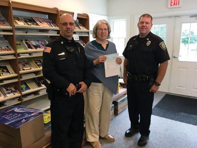 Rochester Police Brotherhood
Rochester Police Officer Crook and Officer Smith presented Plumb Library Director Gail Roberts with a Rochester Brotherhood donation to the Friends of the Plumb Library to help with funding of library programs such as story times and book discussion groups. Photo courtesy Plumb Library
