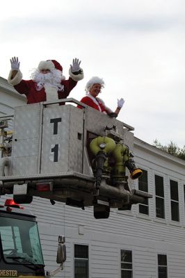 Santa Arrives
The Town of Rochester wasn’t able to host its traditional Christmas celebration this year, but the Fire Department made sure that Santa and Mrs. Claus and Sparky visited with children on Sunday outside Town Hall, where Board of Selectmen Chairman Paul Ciaburri presided over the lighting of the tree. Ciaburri was thrilled to report that the Christmas Angels, run by Lorraine Thompson with volunteers from the Council on Aging, the public library, local businesses, schools, and churches haven’t missed a beat.
