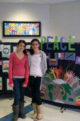 Peace Board
Olivia Lanagan, left, and Tori Saltmarsh, right, stand in front of their Peace Board. The Old Rochester Regional Junior High School Enrichment students created the Peace Board to promote goodwill during the holiday season, and the board depicts the word peace in 26 different world languages. Photo by Anne OBrien-Kakley.
