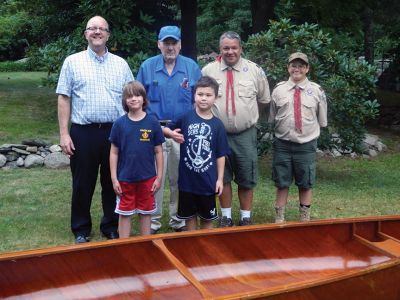 Classic Canoe
Marion resident Paul S. Kohout, donated his 16 foot, mahogany, 1959 Canadian Mounty Police Wooden Cargo Canoe to Marion Boy Scout Troop 32/Cub Scout Pack 32 on Thursday September 11, 2014. The Scouts are honored to have such an amazing vessel offered to them and plan to use it in future outings. Pictured are Paul S. Kohout, Scoutmaster Paul St. Don, Cubmaster Leo Grondin, as well as Scouts Jackson St.Don, Lee Grondin and Oakley Campbell.
