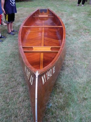 Classic Canoe
Marion resident Paul S. Kohout, donated his 16 foot, mahogany, 1959 Canadian Mounty Police Wooden Cargo Canoe to Marion Boy Scout Troop 32/Cub Scout Pack 32 on Thursday September 11, 2014. The Scouts are honored to have such an amazing vessel offered to them and plan to use it in future outings. Pictured are Paul S. Kohout, Scoutmaster Paul St. Don, Cubmaster Leo Grondin, as well as Scouts Jackson St.Don, Lee Grondin and Oakley Campbell.
