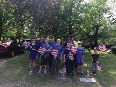 Mattapoisett Boy Scout Troop 53
Mattapoisett Boy Scout Troop 53, with the help of Cub Scouts from Pack 53, assisted Barry Denham with placing flags on the gravestones of service men and women at Cushing Cemetery on Friday, May 25. Photo courtesy Wendy Copps
