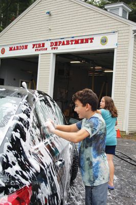 Car Wash
Ari Hayden shows enthusiasm as he applies elbow grease during a car wash held by Grade 6 students at Sippican Elementary School on Saturday morning at Marion Fire Station 2 on Point Road. Money raised will help fund a class trip next spring to YMCA Camp Burgess & Hayward in Sandwich. The event was organized by the Sixth Grade Parents Club and the Volunteers at Sippican Elementary (VASE). Photo by Mick Colageo. October 12, 2023 edition
