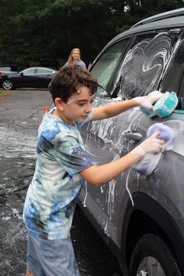 Car Wash
Grade 6 at Sippican Elementary School students turned a dreary Saturday into some fun while washing cars at Marion Fire Station 2 to raise money for their spring-season class trip. Photos by Mick Colageo
