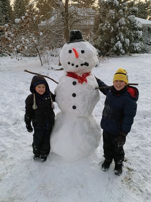 First Snowman
A snowman built on the first school snow day of the 2021-22 academic year by Center School students Henry Kanaly, left, a first-grader, and William Kanaly, a third-grader. Photo by Chuck Kanaly
