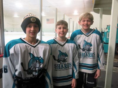 Championship Tournament
Three Tri-Town skaters, (left to right) Carson Spencer, Brendan Burke, and Sam Newton, were part of the Cape Cod Canal Sharks hockey team that participated in the State Championship Tournament in Framingham this past weekend.  Over 70 Peewee Tier IV teams from across the state competed for entry into the tournament, but only 12 teams made it to this final tourney. The Sharks team played hard, but ultimately Needham took home the banner. This is the second year in a row these boys competed in the championshi
