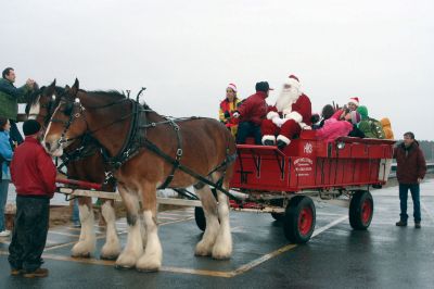 Village Stroll
Heavy rain stopped just in time for Santa Claus to make his first turn around Marion on a wagon pulled by Clydesdale horses during the towns December 12, 2010, Holiday Stroll event. Photo by Laura Pedulli.
