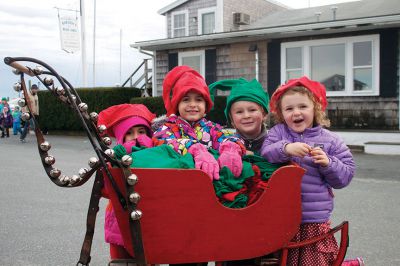 Marion Holiday Stroll
(from right) Addie Crete, Topper Crete, Olivia Medeiros, and Ruby Medeiros spread some Christmas cheer by passing out free elf hats to everybody at the Marion Holiday Stroll on Sunday, December 9.  Photo by Eric Tripoli.
