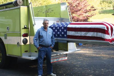 Memorial Engine
Devoted brother and former New Bedford Fire Chief Roger Nadeau poses with an old fire truck that he is converting into a memorial engine to carry fallen firefighters in Massachusetts, and parts of Connecticut, Rhode Island, New Hampshire, and Maine. The engine was donated to Mr. Nadeau by the Weymouth fire department after it developed serious pump problems. Mr. Nadeau's firefighter brother Gerald died from respiratory problems after a 2002 Fall River fire.
