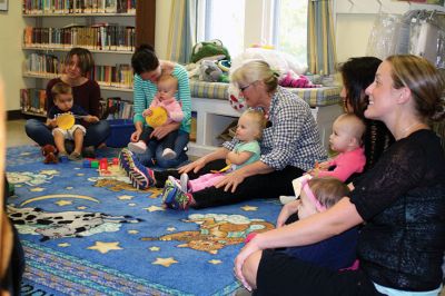 Taber Fall Lapsit Program
The Fall Lapsit Program for babies kicked off on October 7 at the Taber Library in Marion. Babies and their caregivers enjoy 20 minutes of stories and 20 minutes of social time. Children’s Librarian Rosemary Gray delighted five happy babies with some peekaboo, short stories such as Where is Baby’ Belly Button, and songs like the Itsy Bitsy Spider. The program starts at 10:30 am Tuesdays until November 25. Photos by Jean Perry
