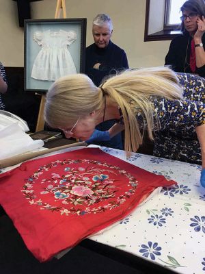 Textile Conservation
Kathryn Tarleton gave a presentation on the art and science of textile conservation on March 18 at the Mattapoisett Free Public Library. She also examined historic articles for several area residents. Photos by Marilou Newell
