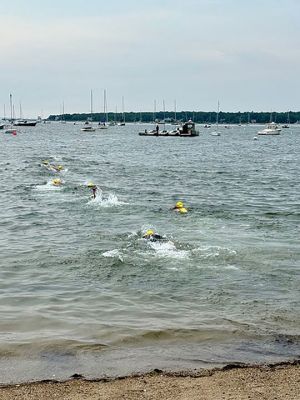 Mattapoisett Triathlon
The Mattapoisett Triathlon took place on Sunday, July 27. The event, hosted by the Mattapoisett Lions Club, saw over 100 competitors begin from Town Beach, swim 0.25 miles, bike 10 miles north of town and back, and finally run a 5K past Ned’s Point and back around to the beach. Photo by Robert Pina
