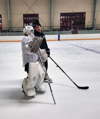 Tucker Roy
Old Rochester/Fairhaven goalie Tucker Roy listens to assistant coach Patrick Aalto during practice last Friday at Tabor Academy. Photo by Mick Colageo
