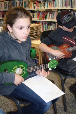 Learning the Ukulele
Lillie Farrell of Rochester gave a beginner’s ukulele class at the Plumb Library on March 3. Farrell, who has won contests for her ukulele playing, taught basic chords to the kids and then helped them put the chords together to play “I’m Yours” by Jason Mraz. Photos by Jean Perry

