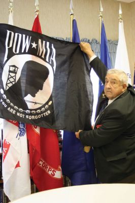 Veteran's Day
State MIA Committee Chairman Roland Gendron poses with the POW MIA Flag during a Veterans Day event at Sippican Healthcare Center on November 3. Photo by Laura Pedulli. November 11, 2010 edition
