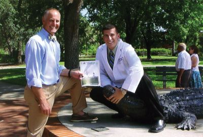 University of Florida Grad
Pictured with The Wanderer is Dr. Jay Gould of the Mattapoisett Animal Hospital who recently presented Mattapoisett resident Michael Raposo with his white coat at the University of Florida College of Veterinary Medicine in Gainesville, Florida where Michael also received the Ambassador Award

