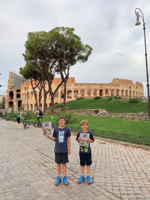 Roman Colosseum
William Kanaly, left, and Henry Kanaly of Mattapoisett display copies of The Wanderer in front of the Roman Colosseum during their end-of-the-summer, family vacation to Italy. William, nine, is in the fourth grade at Old Hammondtown School, and Henry, seven, is in the second grade at Center School. Photo courtesy of Chuck Kanaly
