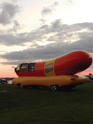 Wienermobile at Ned's Point
Those enjoying the afternoon at Ned’s Point Lighthouse on Sunday, August 17 did a double take when they suddenly saw a sight they were not expecting to see — a giant wiener on wheels parked alongside the Ned’s Point lighthouse. It was not just any wiener on wheels — it was the famous Oscar Mayer Wienermobile, on location taking some promotional photographs from Mattapoisett’s most iconic setting. Photo by Denise Mello
