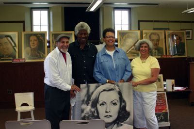 Zeiterion History
Movie enthusiast Tom Shire, Bob and Donna Grier, and Alice Shire were among those present at a Mattapoisett event, led by Mr. Shire, that celebrated the golden days of cinema. Greta Garbo was present at the library talk, too  at least, in spirit. Photo by Joan Harnett-Barry.

