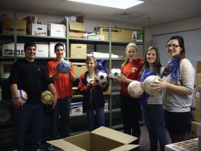 Donations for Afghanistan
Students from the Community Service Learning Council at ORRHS have finished packing 50 boxes of clothes, shoes and soccer balls for injured children. They are working to collect donations to ship the items to Afghanistan. Pictured from left to right: Tess Washburn, Madison Costa, Lauren Pettinato, Jordan Seim, Abby Duncan. Luke Mattar is seated in front. Photo courtesy of Debbie Stinson.
