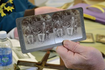 Library Treasures
Word spread of the Antiques Roadshow-style fundraiser at the Mattapoisett Library on March 29, attracting scores of South Coasters clutching their treasures, antiques, and heirlooms for appraisal and admiration, hoping Francis McNamee of the Marion Antique Shop might discover worth in their belongings beyond their sentimental value. Paying $5 per item appraised, some brought primitive dolls, old books, tea sets, and artwork. By Jean Perry
