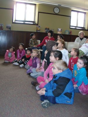 Chinese Culture
Children learned about Chinese culture and the Year of the Rabbit at a February 24, 2011 Mattapoisett library event. Librarian Linda Burke read a traditional Chinese story, and then the children enjoyed making their own dragons, watched as Haiying Zhang wrote their names in Mandarin, and tried eating fried rice with chopsticks. Photo by Anne Kakley.
