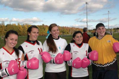Boxing Glove Donation
The ORR Field Hockey team members donned pink boxing gloves to fight cervical cancer at an October 19 game. The team decided this years fundraising donations would benefit a cervical cancer foundation. From left to right: Senior captains Sarah Walsh, Kayla Souza, sophomore Sarah Marchisio, and captains Lauren Grainger, and Lauren O'Brien, helped to organize the fundraiser. Photo by Betty Smith.
