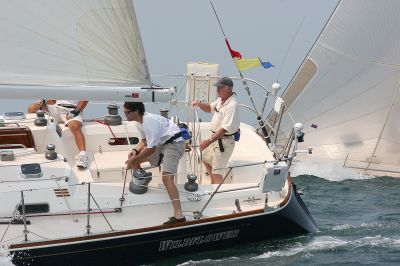 2005 Buzzards Bay Regatta II
Ron Noonan of the Beverly Yacht Club in Marion skippers Wildflower to second place in the PHRF Cruise 5 class. (Photo by and courtesy of Fran Grenon, Spectrum Photo, www.spectrumphotofg.com).
