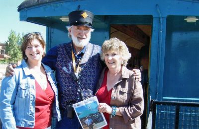 The Way to Santa Fe
Caryl Vermilya and daughter Kimberly Bindas pose with a copy of The Wanderer and an unidentified conductor while traveling on the Santa Fe Southern Railway. (11/08/07 issue)

