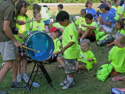 Summer Camp
Five-year-old Kenny plays the drum with Pulse Integration of Lynnwood, CT during the Fifth Annual Camp Angel Wings in Mattapoisett. Pulse Integration was one of the organizations mentoring youth at this years bereavement camp which was sponsored by Southcoast Home Care, Hospice and Palliative Care and Infusion Services of Fairhaven in collaboration with the Mattapoisett YMCA. (Photo courtesy of Joyce Brennan).

