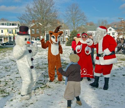 Merry Christmas!
Familiar Christmas holiday icons Frosty the Snowman, Rudolph the Red-Nosed Reindeer, and Santa and Mrs. Claus dance with an eager young boy during the Town of Mattapoisetts Holiday in the Park held at Shipyard Park earlier this month. (Photo by and courtesy of Rebecca McCullough).
