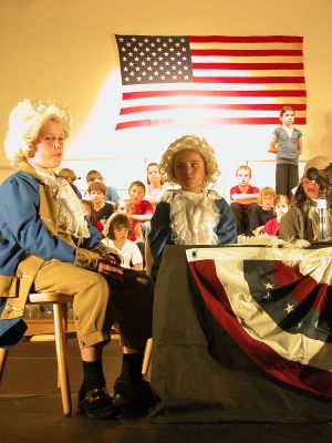 United We Stand
Center School students Luke Gauvin (left) as James Madison and Meredith Gauvin (center) as George Washington go through a dress rehearsal for the Mattapoisett schools annual end-of-the-year third grade production titled United We Stand. This years play focused on the founding of our nation and featured such songs as Weve Got To Be One People, Shhh! Were Writing the Constitution, and Its Wise to Compromise. (Photo by Kenneth J. Souza).
