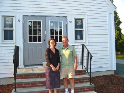 Closing A Chapter
Rochesters Facilities Manager Mike Meunier poses with outgoing Library Director Olivia Melo in front of the newly-finished front foyer at the Plumb Memorial Library  one of Ms. Melos completed projects. After three years as Library Director, Ms. Melo is leaving Rochester to take a job with the Lakeville Public Library. (Photo by Nancy MacKenzie).
