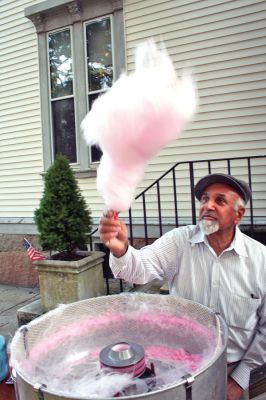 Sweet Treat
Marion resident Thomas Shire spins some fresh cotton candy treats during the end-of-summer Marion Block Party held on Sunday, August 31 in front of the Marion Town House. Sponsored by the Benjamin D. Cushing Post 2425 VFW, the annual event has a long history in the Town of Marion and included plenty of food, fun and frolic with dancing and music courtesy of DJ Roger Chartier. (Photo by Robert Chiarito).

