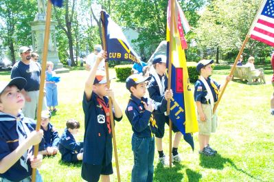 Mattapoisett Memorial Day 2005
Members of the Mattapoisett Cub Scout Troop stand at attention outside the Mattapoisett Free Public Library during Memorial Day Services this past week. The annual observance drew a sizeable crowd which was treated to public speakers, performances of patriotic music by the Old Hammondtown School Band, and a keynote address from Commander John Landis, USN, of the Newport Naval War College. (Photo by Kenneth J. Souza).

