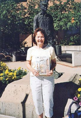 Coal Miner's Daughter
Donna Maxfield of Marion poses with a copy of The Wanderer in front of a statue of a coal miner with his lunch pail in Louisville, CO during a recent visit to her grandchildren, Holden and Eliza. (09/04/08 issue)
