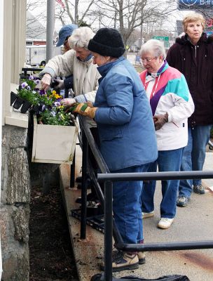 A Touch of Spring
The Garden Group of the Mattapoisett Woman's Club took time last week to add a touch for spring to the window boxes at the post office. The woman's club also maintains the flowers outside the Town Hall, the Library, Mattapoisett Museum and Carriage House, and the Triangle (Rte. 6). Those helping out with the project included Sandy Hering (back on the left) and Estelle Jacobson (on the right), and not pictured: Marilyn Flood,  Priscilla Hathaway, Peg Olney, and Lee Yeaton. (Photo by Paul Lopes)

