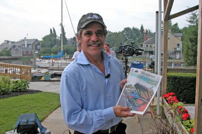 Geraldo at Large
A Marion summer resident since 1980, TV news reporter Geraldo Rivera poses with a copy of The Wanderer just after his guest appearance on the FOX 25 Morning News Shows Zip Trip remote from the Marion Town Wharf. (Photo by Kenneth J. Souza).

