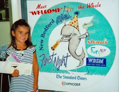 Whale Winner
Five-year-old Kate Lima of New Bedford is the winner of the Name the Whale Contest sponsored by First Night New Bedford. Kate chose to name the events tell-tale mascot Welcome the Whale. The First Night New Bedford 2006 committee chose the winning name Welcome for its cheerful whale design depicted on First Night buttons and posters. Kate received several prizes for her winning entry.
