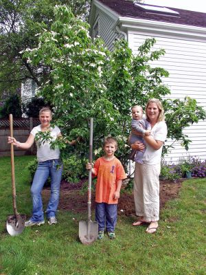 Planted in Mattapoisett
(L. to R.) Katherine, Ben, Patrick and Laura Shachoy stand by their newly-planted Kousa Dogwood, marking the first tree in the Mattapoisett Tree Committees 150 by 150 tree-planting project. The year-long campaign is being planned to commemorate the towns 150th Anniversary in 2007. (Photo by and courtesy of Laura McLean).
