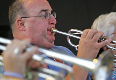 Man With a Horn
Trumpeter Bob Williamson of Mattapoisett is seen here playing at a recent performance of the Marion Concert Band. The popular weekly summer series of free concerts is held on Mondays beginning at 7:30 pm at the bandstand on Island Wharf in Marion. (Photo by Andrew T. Gallagher).
